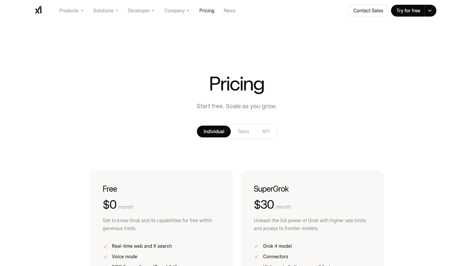 Official xAI pricing page on desktop showing SuperGrok and SuperGrok Heavy plan cards and account navigation.
